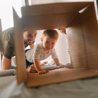 Happy resident family having a playtime at Stadium West Apartments in Arlington, Texas