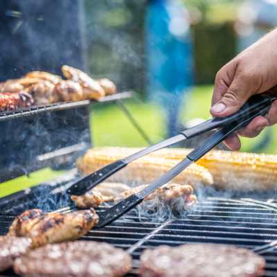 Resident grilling at The Canopy Apartment Villas in Orlando, Florida