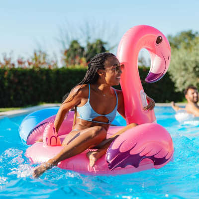 Resident woman in a swimming pool at Towne Creek Apartment Homes, Gainesville, Georgia