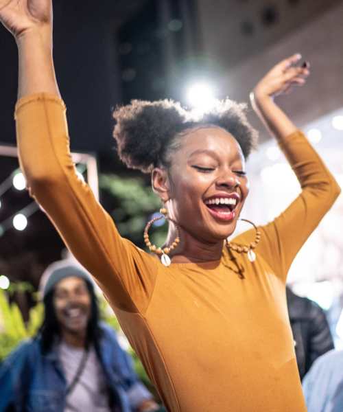 Woman enjoying at a party near 1729 Midtown in Lexington, Kentucky