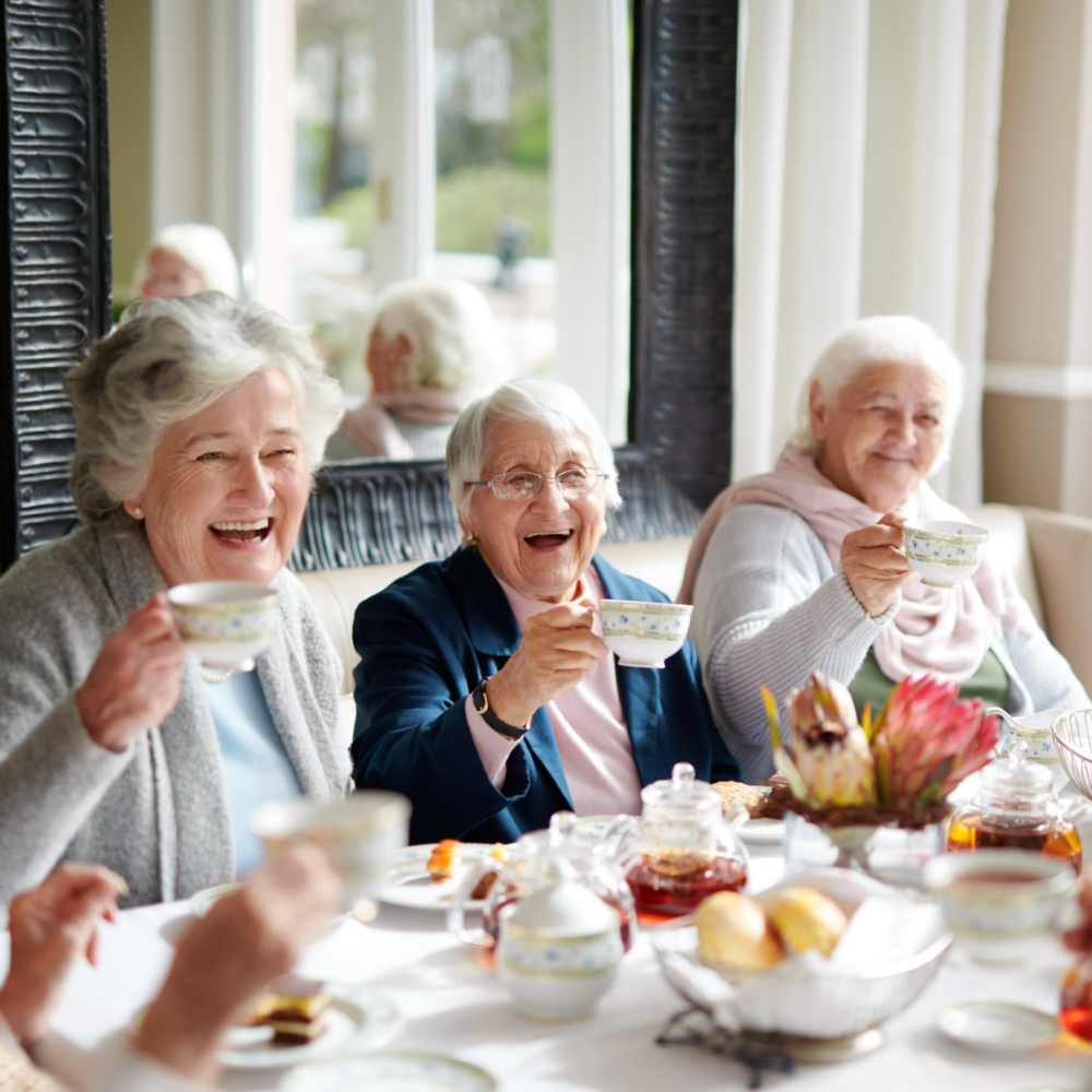 Group of friends enjoying tea at Clearwater at The Arboretum in Austin, Texas