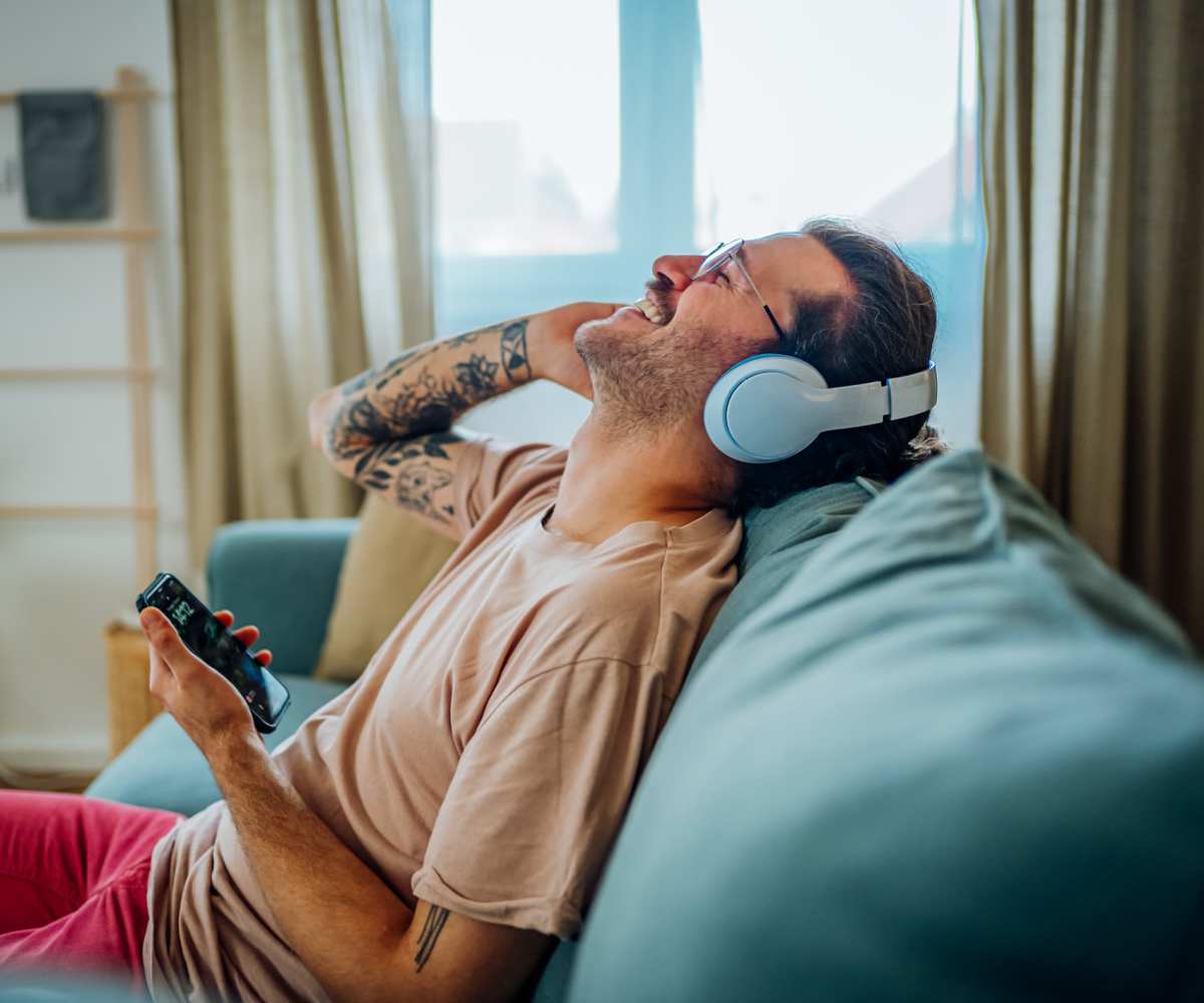 Resident listening music at Farmington Townhomes in Farmington, Minnesota