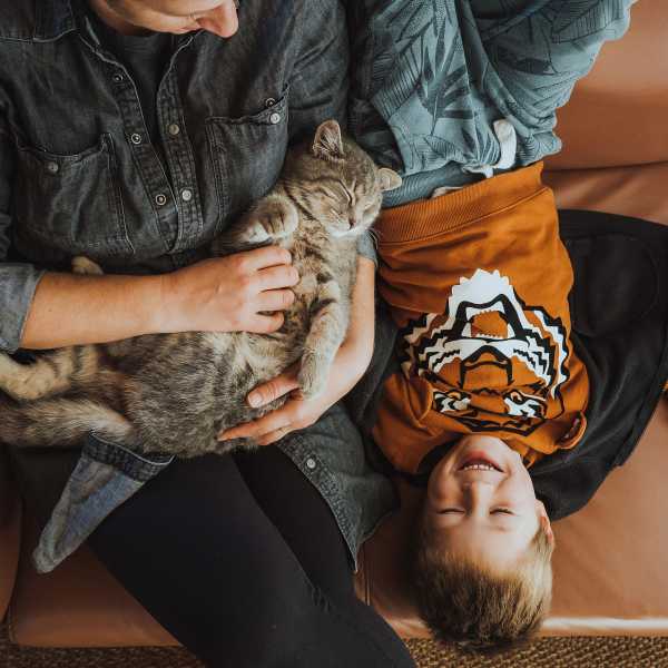 Father and son hold their cat at Attain at Quarterpath, Williamsburg, Virginia