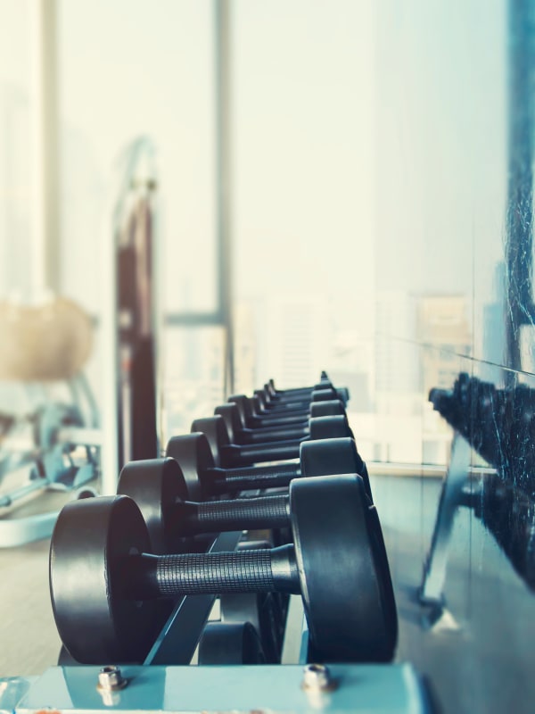 Spacious gym with individual workout stations at Capitol Place Apartments in West Sacramento, California