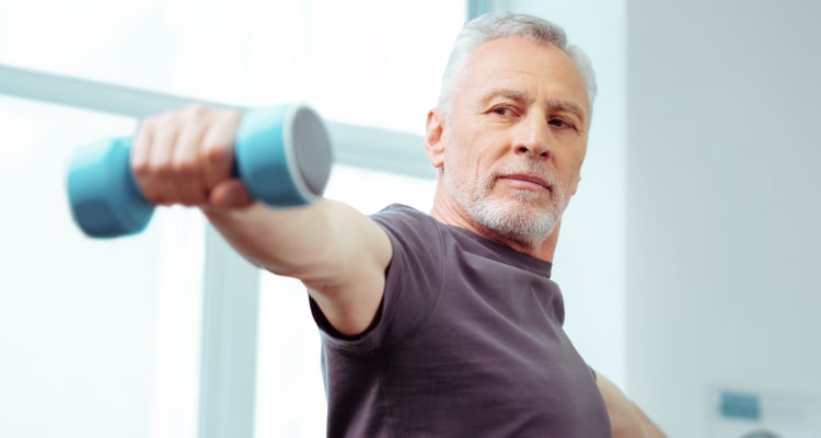 Resident getting in shape in the fitness center at Park Place at Fountain Hills in Fountain Hills, Arizona