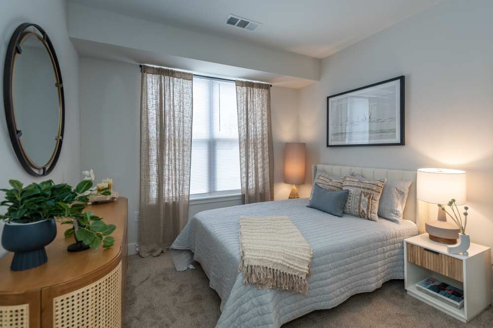 Cozy bedroom with pair of lamps at Attain at Chic’s Beach, Virginia Beach, Virginia