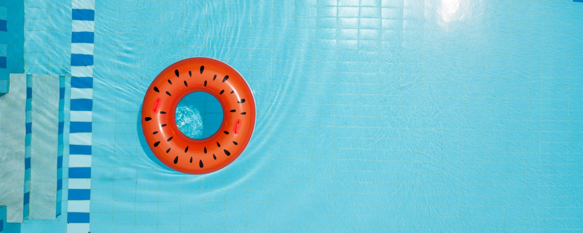 Inner tube in swimming pool at Coral Sea Park in Lemoore, California