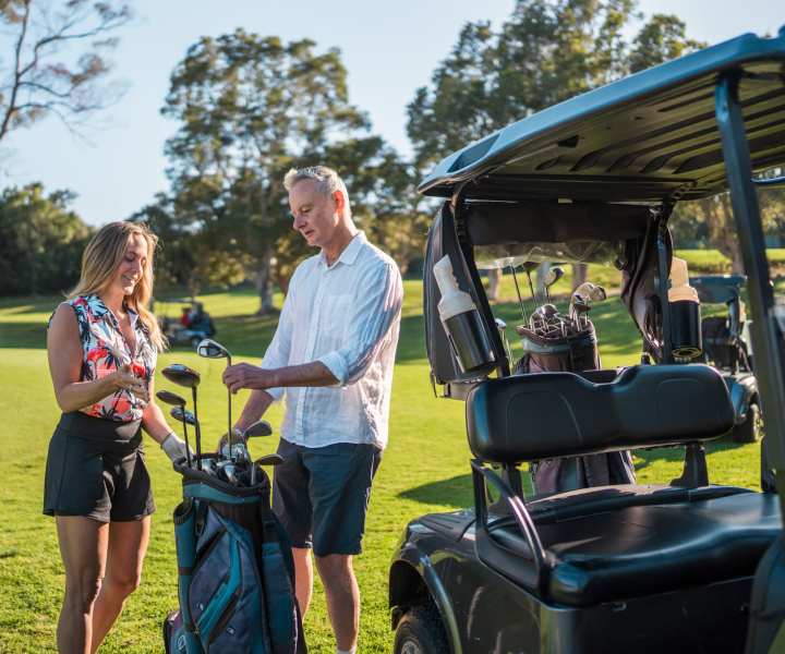 Couple enjoying golf at course near Springwood at Aliana in Richmond, Texas 