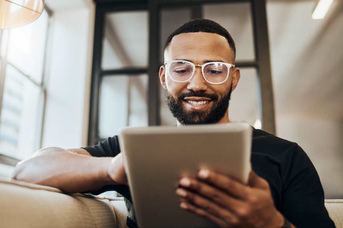 Resident using his tab at North Grand Villas in Amarillo, Texas