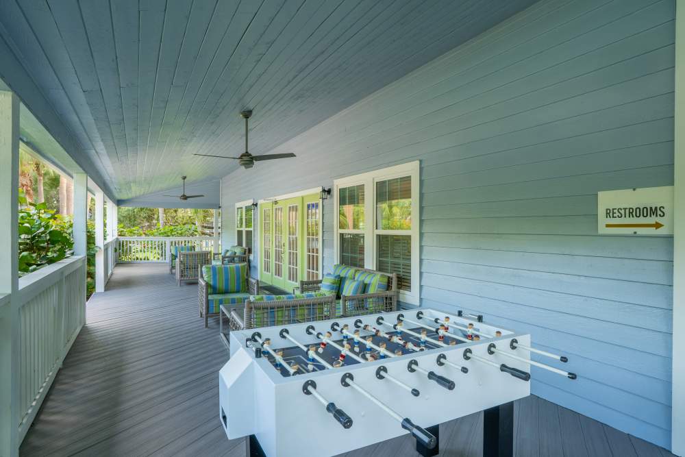 Covered patio seating outside the clubhouse at Mode at Ballast Point in Tampa, Florida