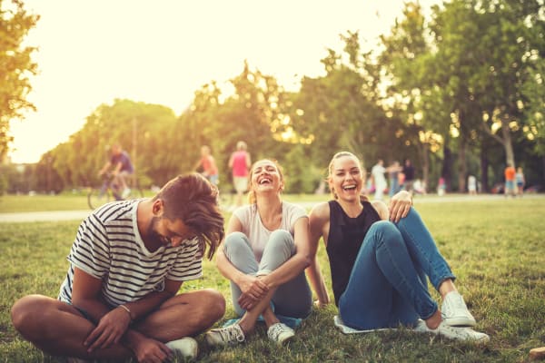 some friends at a park near Centennial East Apartments in Englewood, Colorado