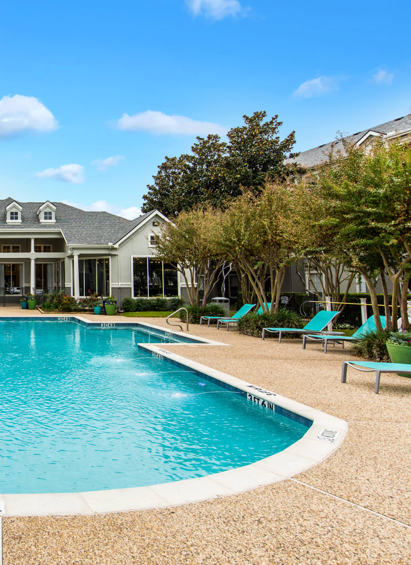 Shallow end of pool with gazebo area and clubhouse in background at Marquis at Stonegate in Fort Worth, Texas