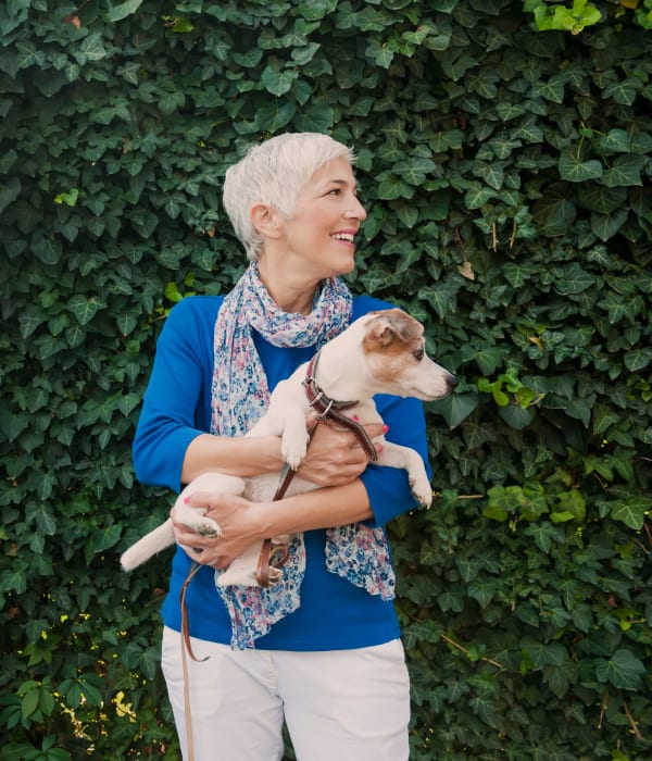 Resident holding her dog at Eagle Rock Apartments at South Nyack in South Nyack, New York