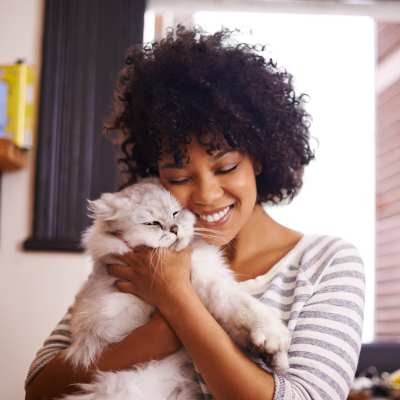 A resident cuddles with her cat at The Blake, Alexandria, Virginia