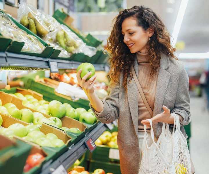 Resident picking up some fresh fruits and vegetables at Lofts At Glenhaven in Winston Salem, North Carolina