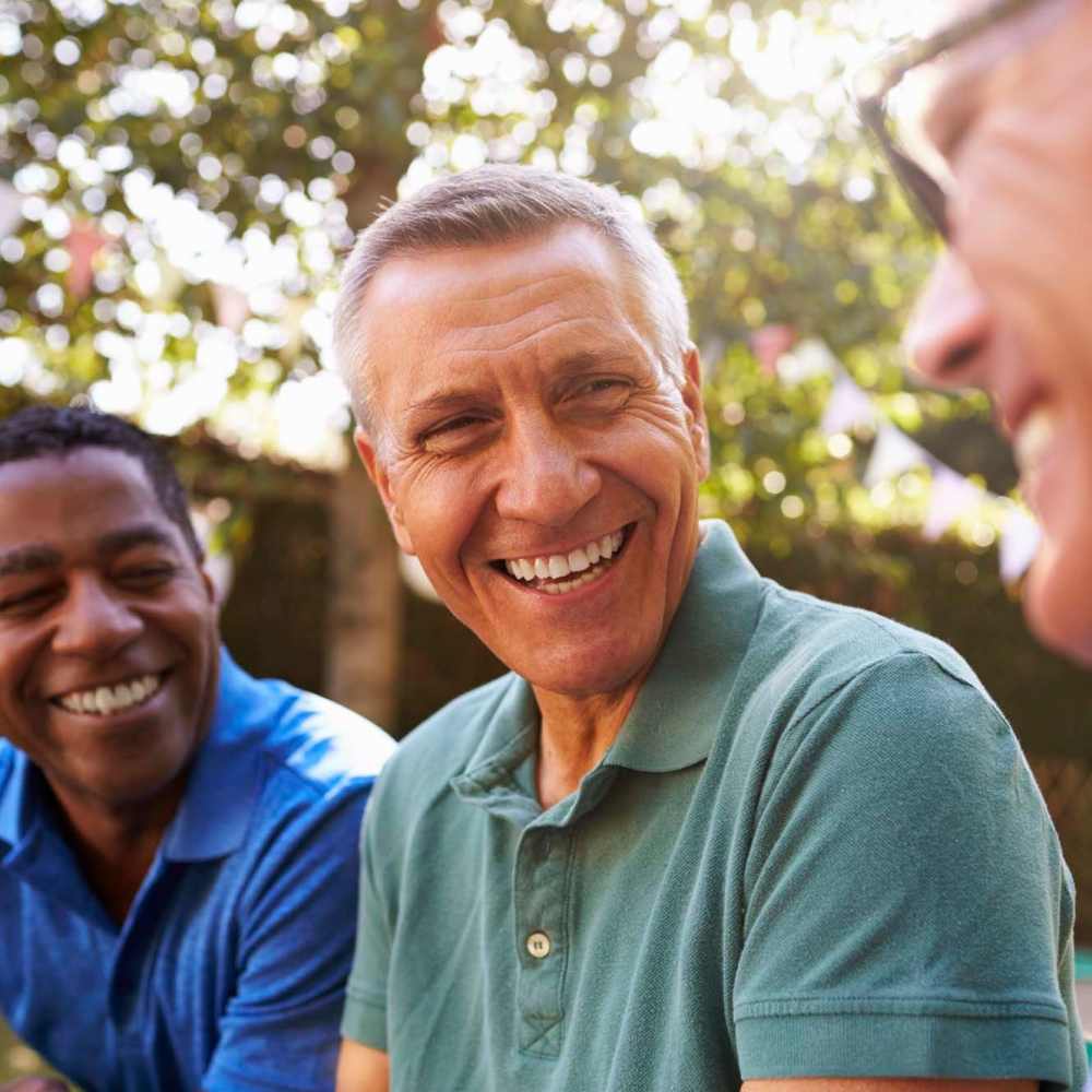 Residents hanging out together outside at Crockett Manor Senior in Crockett, Texas