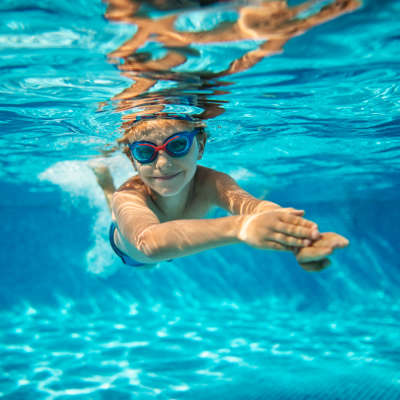 Resident enjoying in pool at Century Stone Hill South, Pflugerville, Texas
