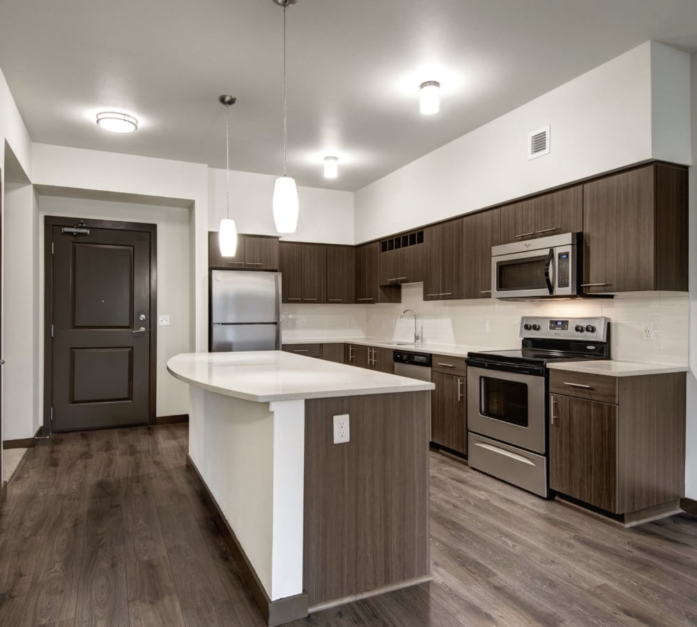Stainless-steal appliances and granite counters in a home's kitchen at Tessera at Orenco Station in Hillsboro, Oregon