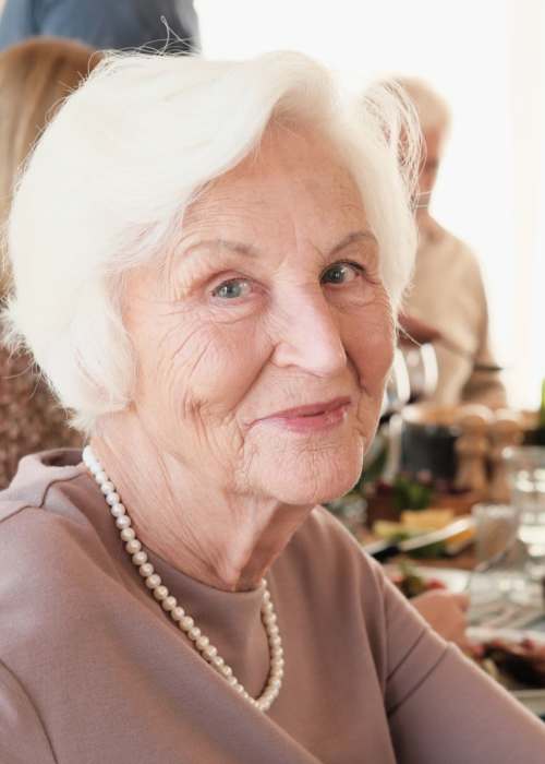 Happy resident having meal at Silver Creek in St. Augustine, Florida