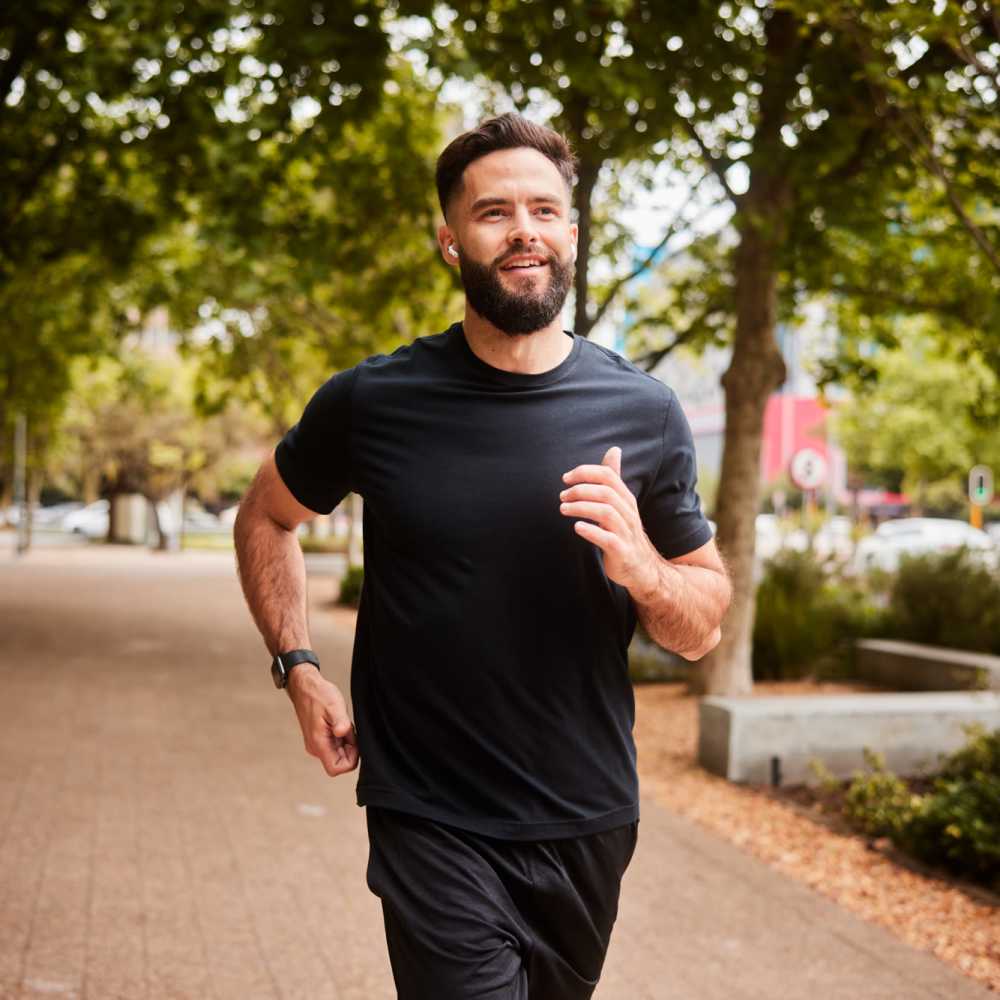 Resident jogging on a path near Monamos Terrace Apartments in Murrieta, California