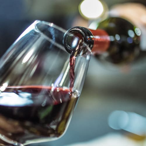 Red wine poured into a glass at Palisades Sierra Del Oro in Corona, California