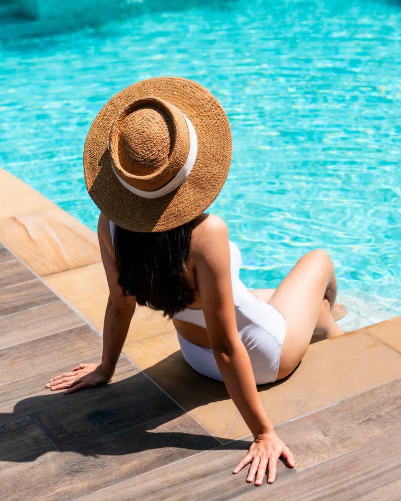 Resident enjoying pool at Maple and Main Apartments in Downers Grove, IL