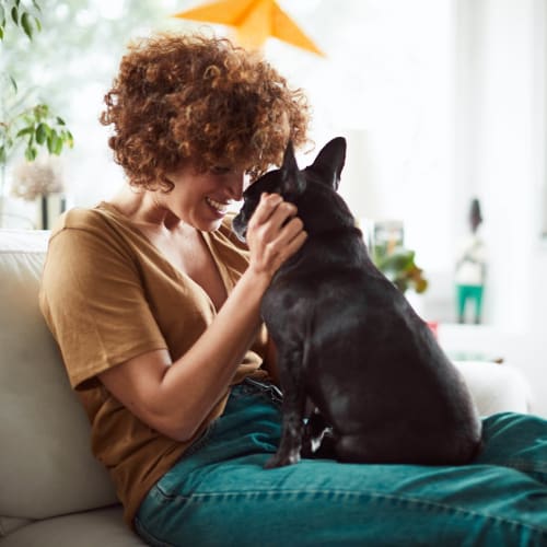 Happy resident and her pup loving their home at Elevation Chandler in Chandler, Arizona