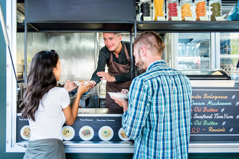Residents ordering lunch at one of the food carts near Brooklyn Yard in Portland, Oregon