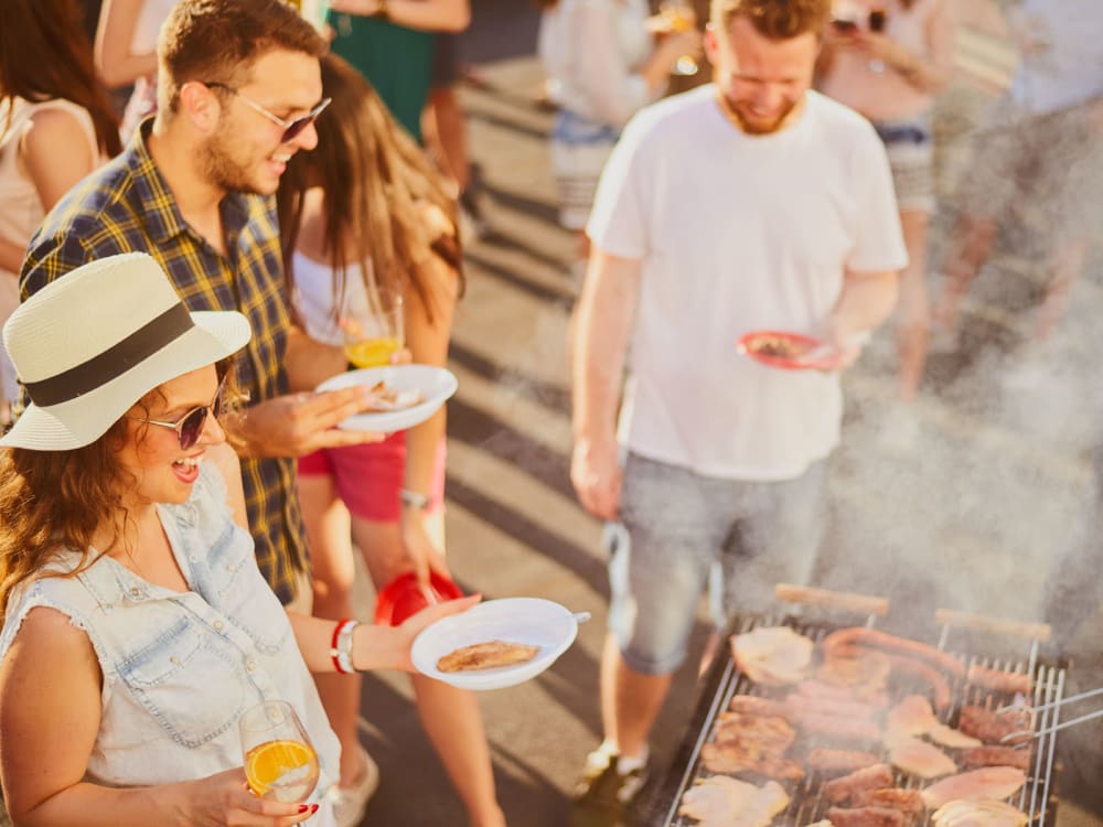 Residents enjoying fresh barbecue near Aviva Goodyear in Goodyear, Arizona