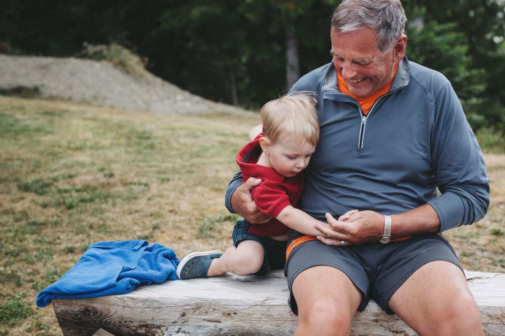 Father and son playing at park near Encore at Heritage Woods in Dexter, Michigan