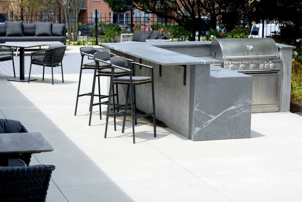 Barbecue grill with stools at Beacon Hill Apartments in Alexandria, Virginia