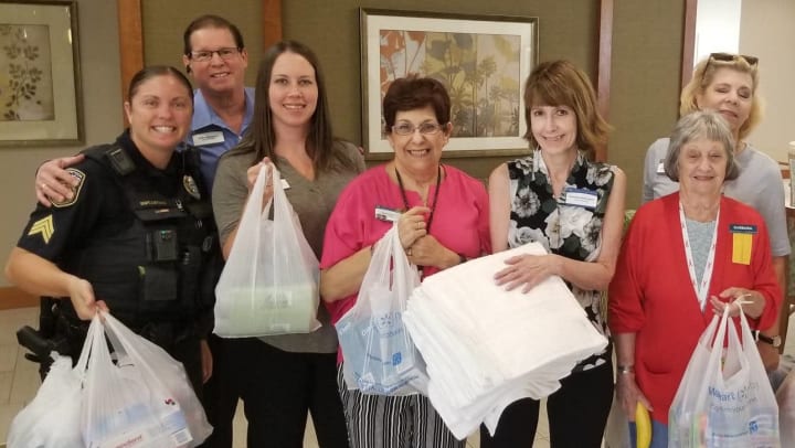 Community team with supplies for MG Carolina Park residents