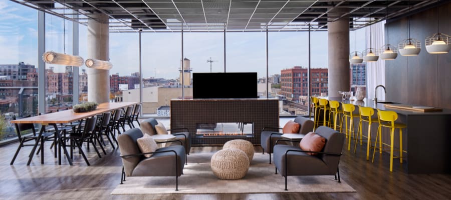 Resident lounge area with great views from the surrounding windows at The Parker Fulton Market in Chicago, Illinois