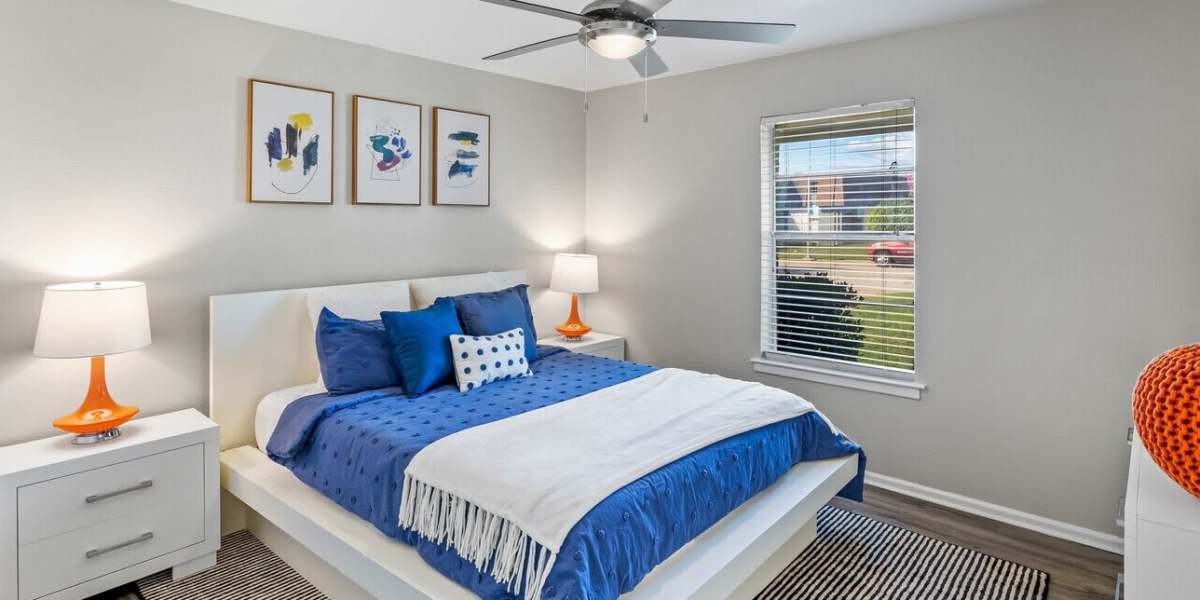 Bedroom with wall art at The Hayes Apartments in Fort Worth, Texas