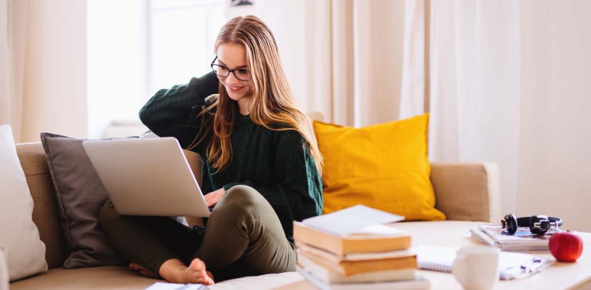 A resident works remotely from her apartment at Promenade Pointe, Norfolk, Virginia 