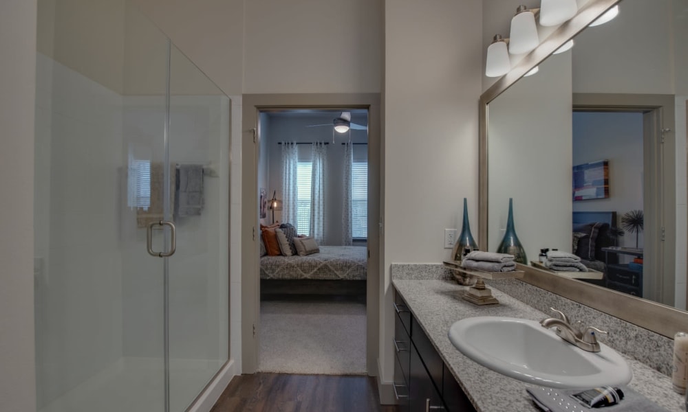 Bathroom with huge mirror at Bellrock Upper North in Haltom City, Texas