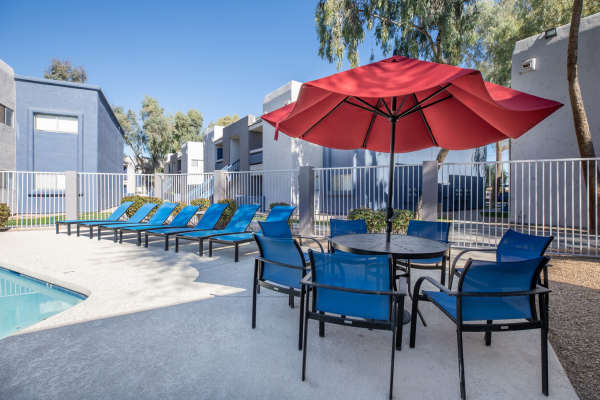 Resort-style swimming pool with lounge chairs on the deck at The Summit At Metrowest in Orlando,Florida