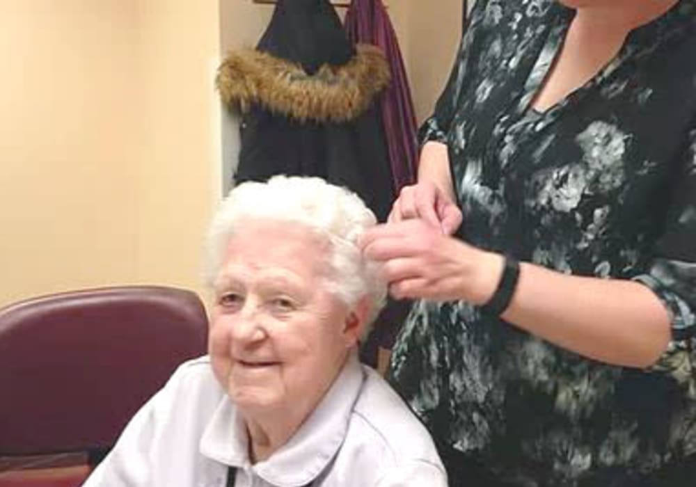 Resident having her hair done at Bell Tower Residence Assisted Living in Merrill, Wisconsin