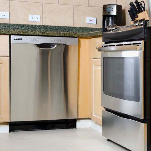 Kitchen with stainless-steel appliances including dishwasher at The Windermere in Littleton, Colorado
