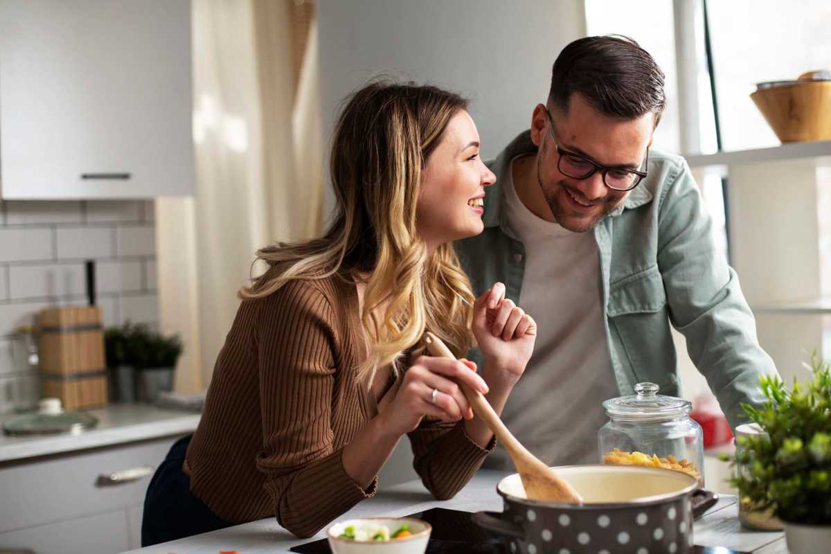 Resident cooking in kitchen at Liberty Village in Monroe, Louisiana