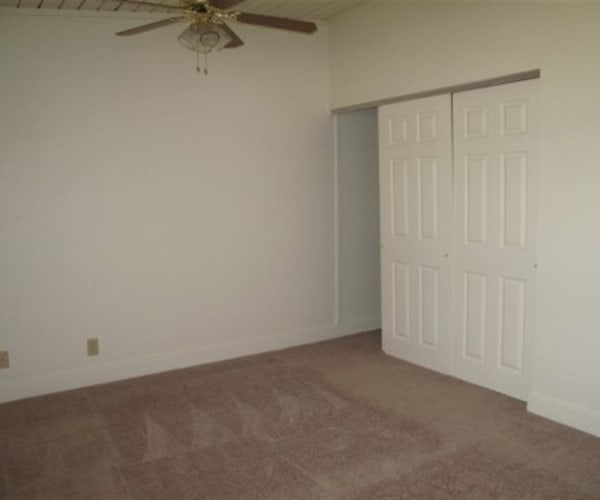 A bedroom with a ceiling fan at Dam Neck in Virginia Beach, Virginia