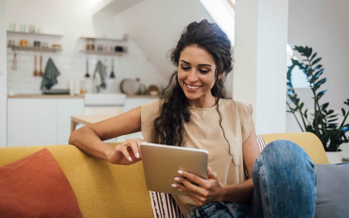 Resident using online portal in her tab at Country Brook Rental Condominiums in San Ramon, California