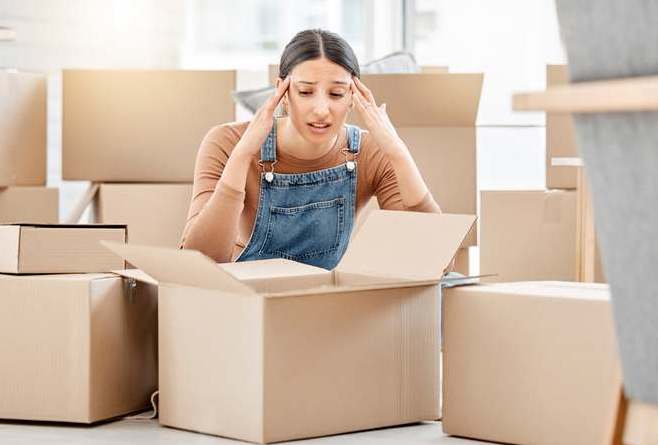 woman packing boxes in the heat self storage portland oregon 