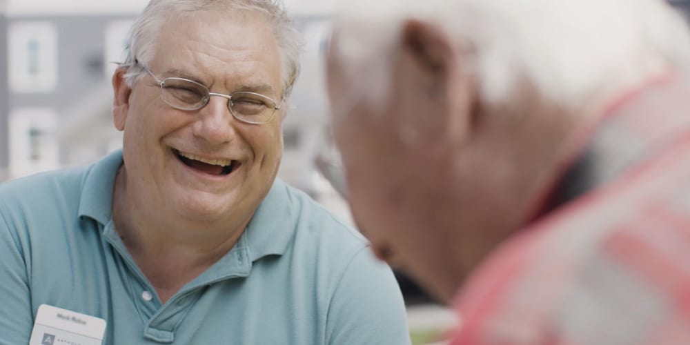Residents laughing together at a Anthology of Grayslake community