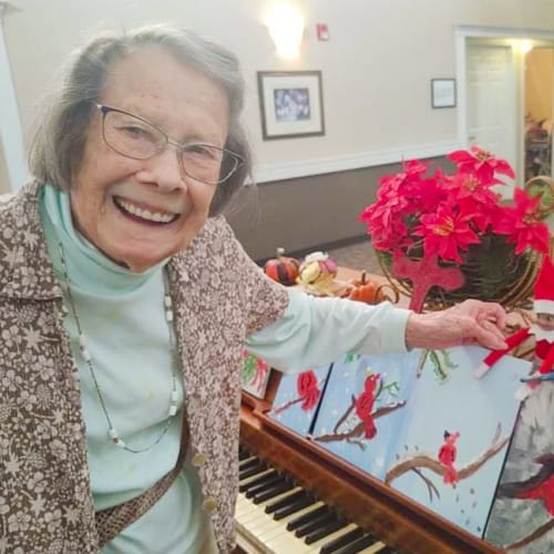 A resident at the piano at Canoe Brook Assisted Living in Wichita, Kansas