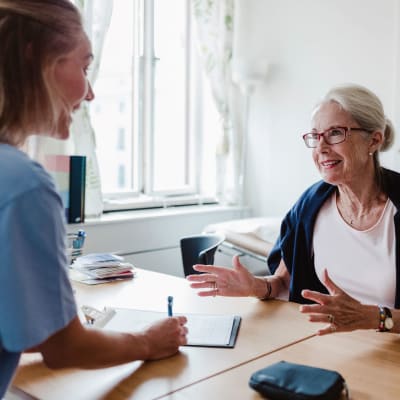 Family members discussing a resident's care plan together at Peoples Senior Living in Tacoma, Washington