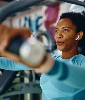 Resident working out in our fitness center at Hayloft Big Creek in Alpharetta, Georgia