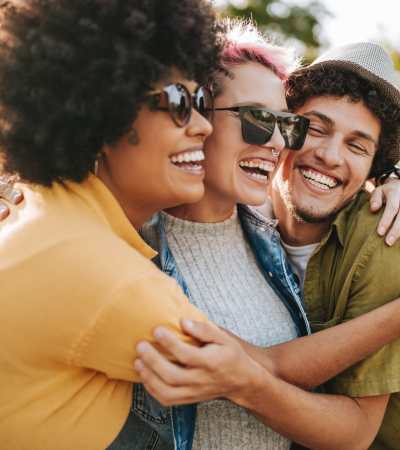 Happy residents spending time together in a park near Isles at East Millenia in Orlando, Florida