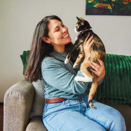 Resident playing with her cat at 10 Newbridge in Asheville, North Carolina