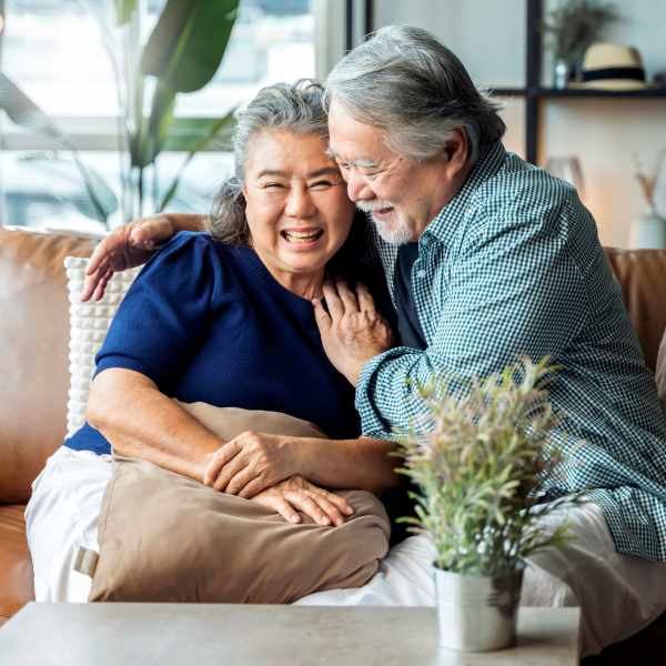 A couple happy in their apartment at Attain at Quarterpath, Williamsburg, Virginia